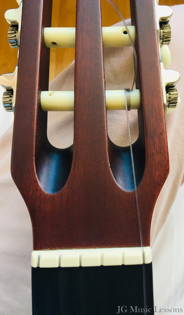 Insert the string on the tuning peg - image 2